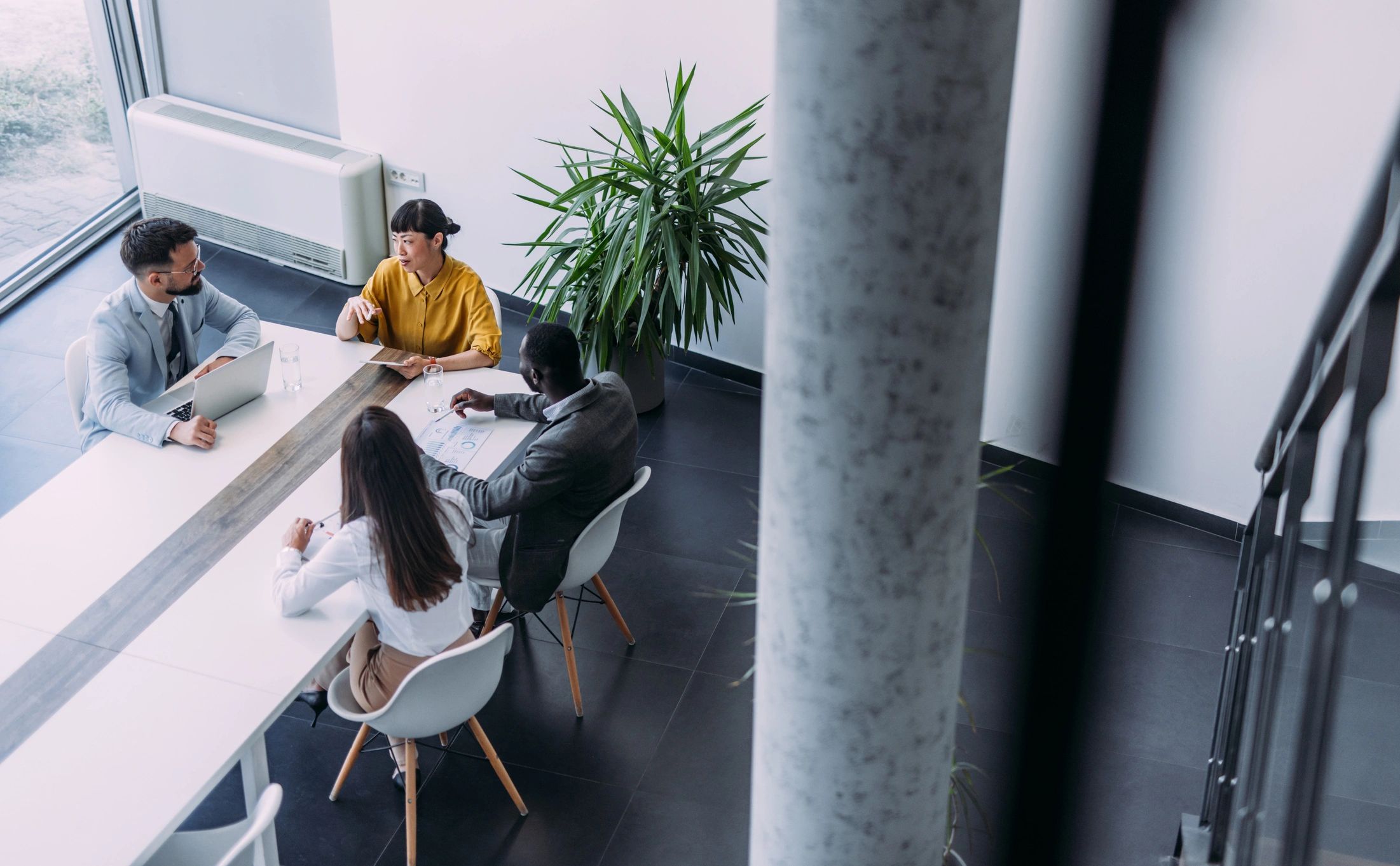 Consulting team reviewing business technology plans