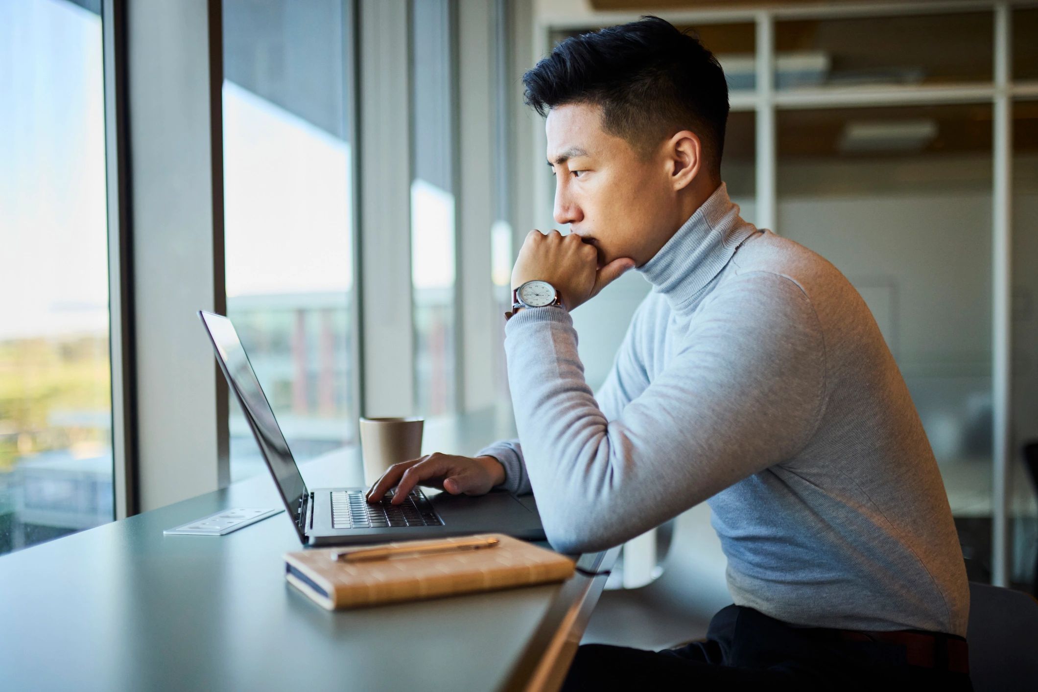 Executive consultant working on technology strategy in an office